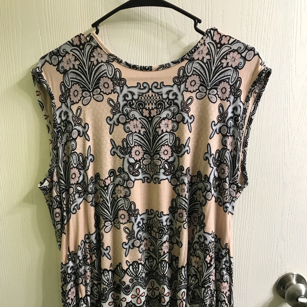 Rose and olive sleeveless blouse.